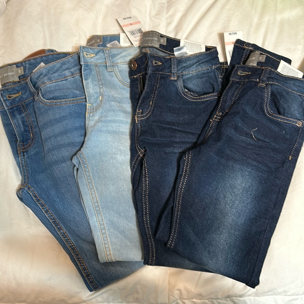 NWT Four pairs of girls size 10 lucky brand jeans.